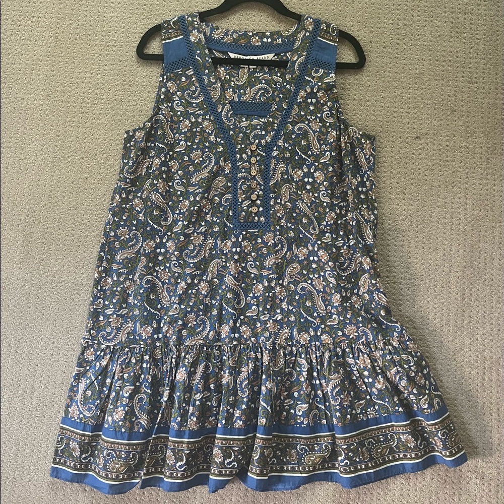 A multi color, sleeveless blouse size large.